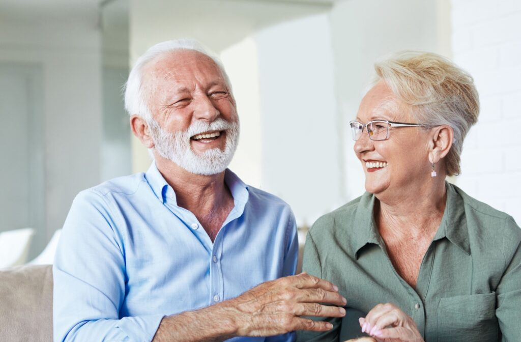 Two seniors enjoy their new life at their senior living community.